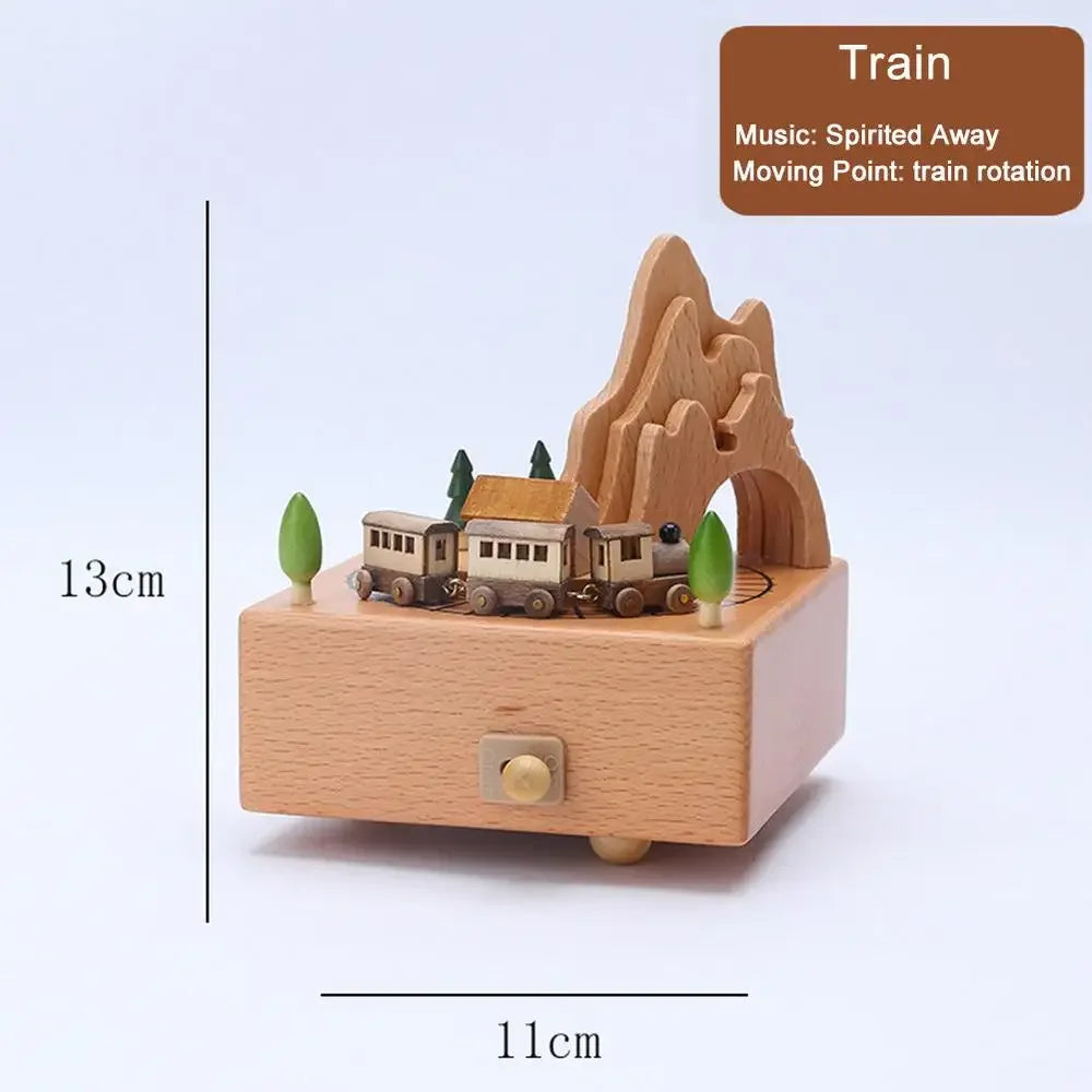 Wooden music box with train design and mountain landscape, featuring dimensions and a label indicating train rotation. | Oliver & Company Montessori Toys