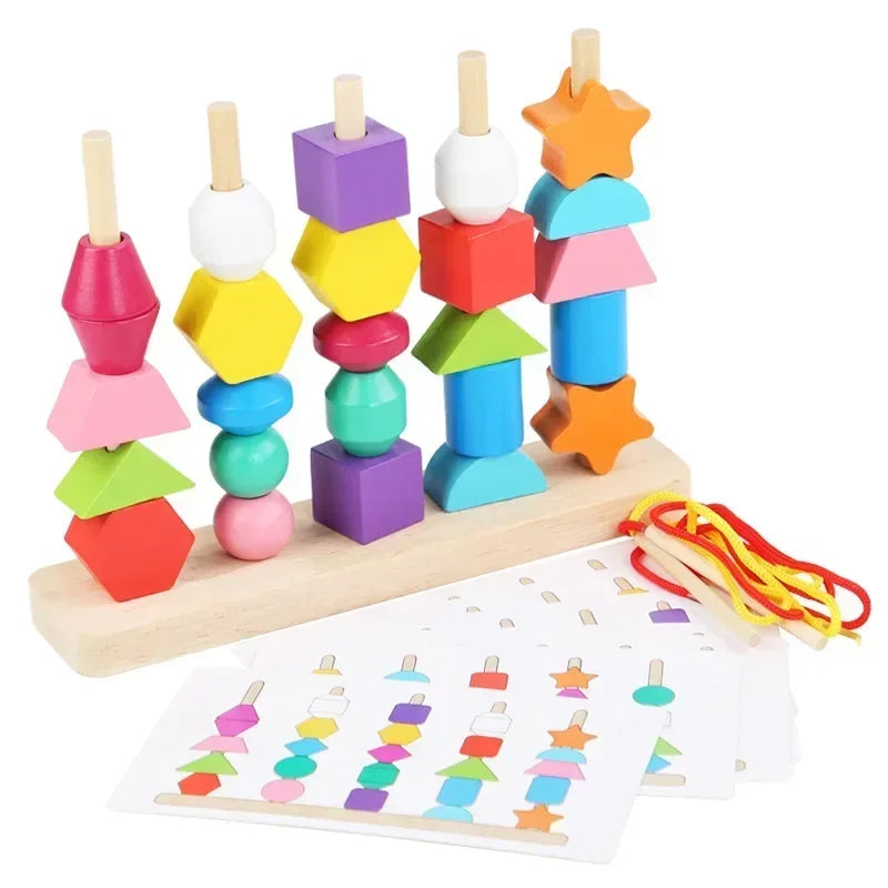 Colorful wooden stacking toy with shapes and a paper with shapes on a white background