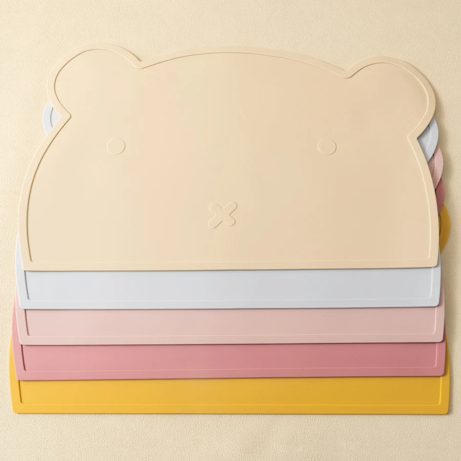 Stack of bear silicone placemats in five colors