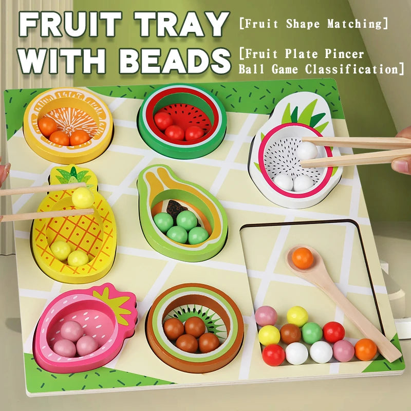 Fruit tray with beads and wooden sticks on a green background