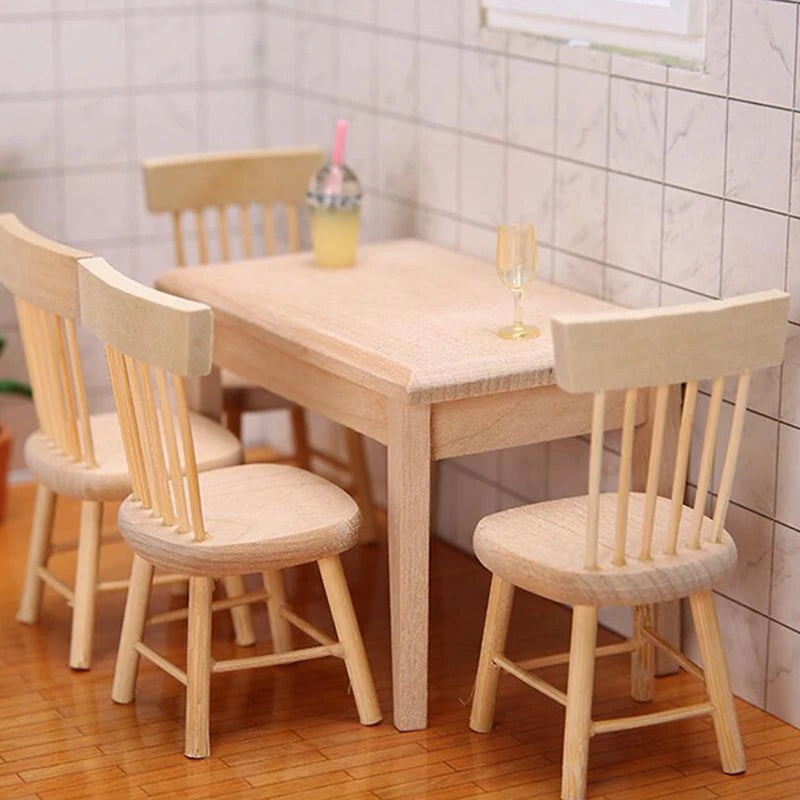 Wooden dining table with four chairs in a room with tiled walls.