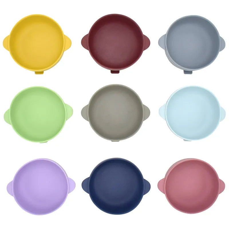 Two-handle silicone bowls seen from above in nine colors