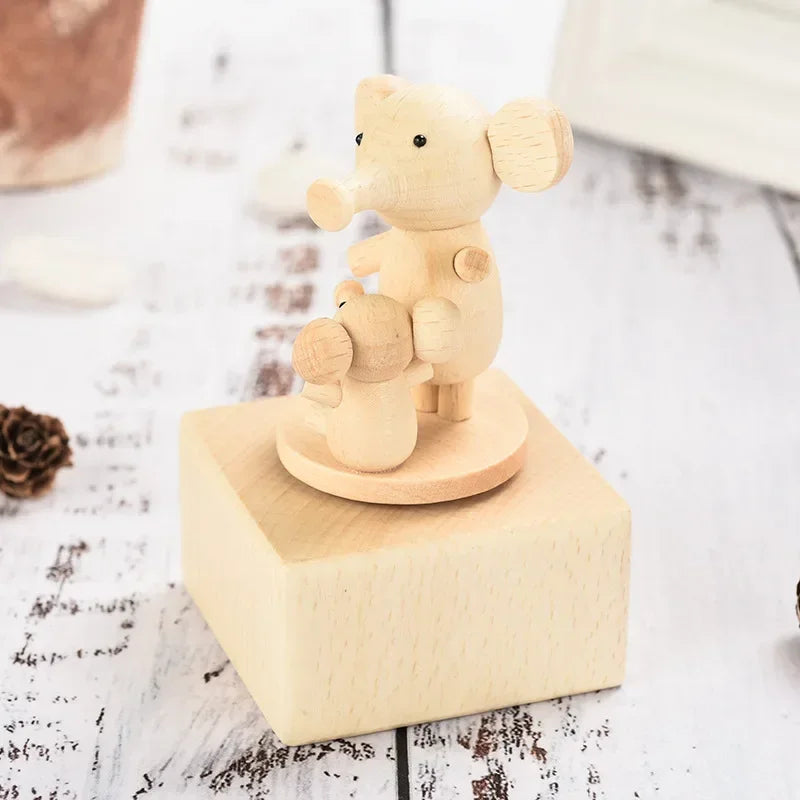 Wooden teddy bear figurine on a square base with a blurred background | Oliver & Company Montessori toys