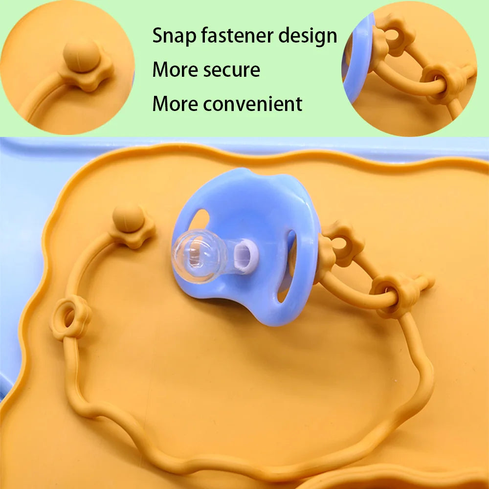 Snap fastener holding a pacifier on a mustard strap