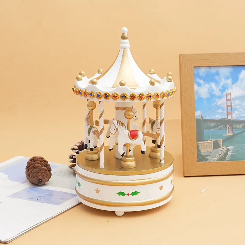 Decorative carousel toy on a table with a scenic picture in the background
