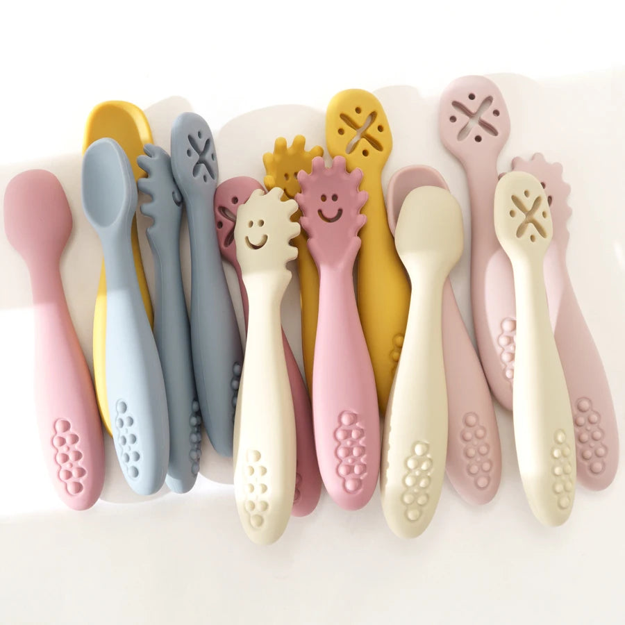 Learning spoons in many colors standing in a cup