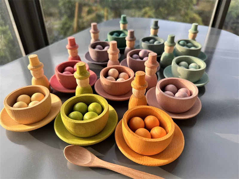 Colorful toy food set on a table with a window in the background