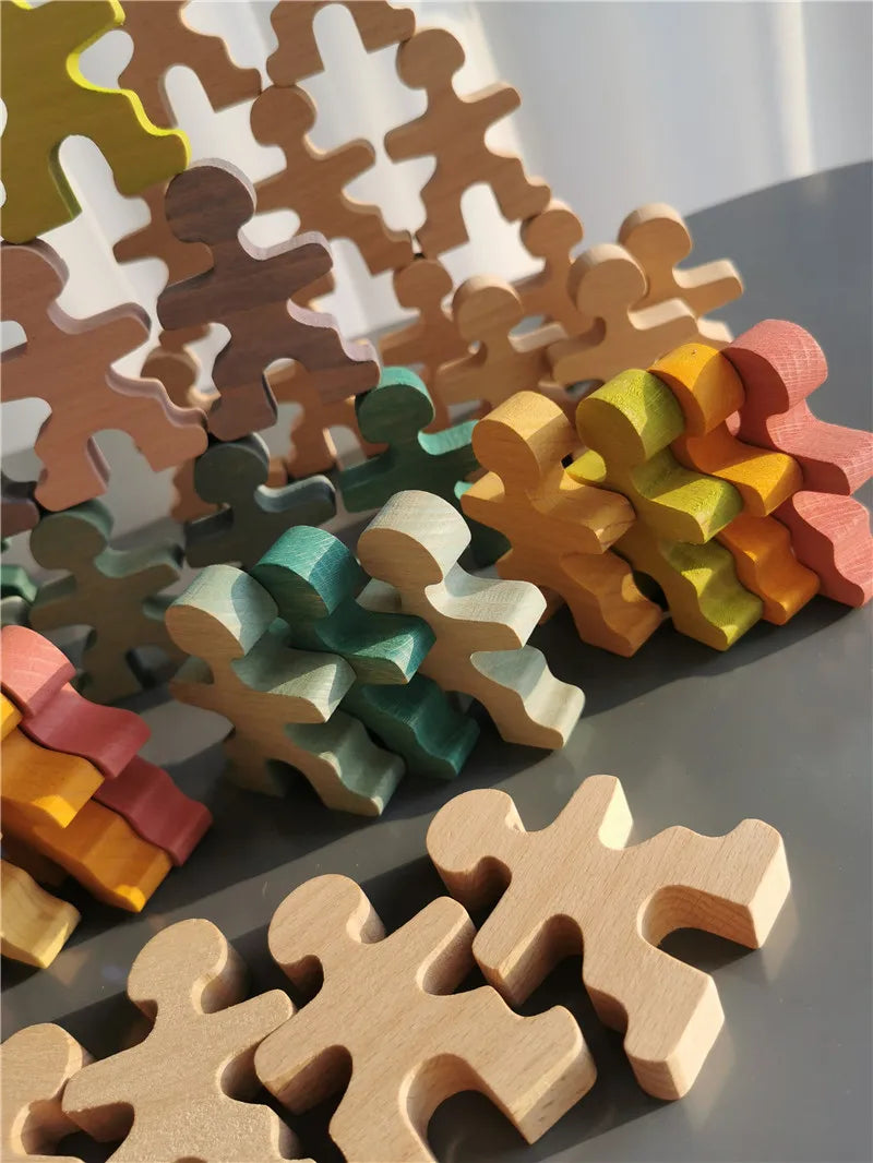 Colorful wooden puzzle pieces on a reflective surface