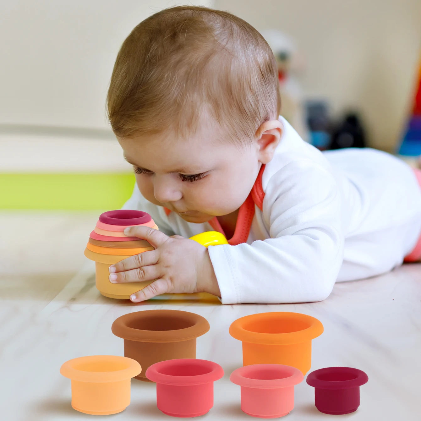 Baby playing with silicone stacking cups