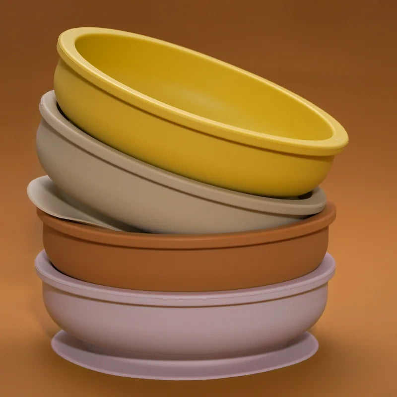 Stacked wide silicone bowls in several colors