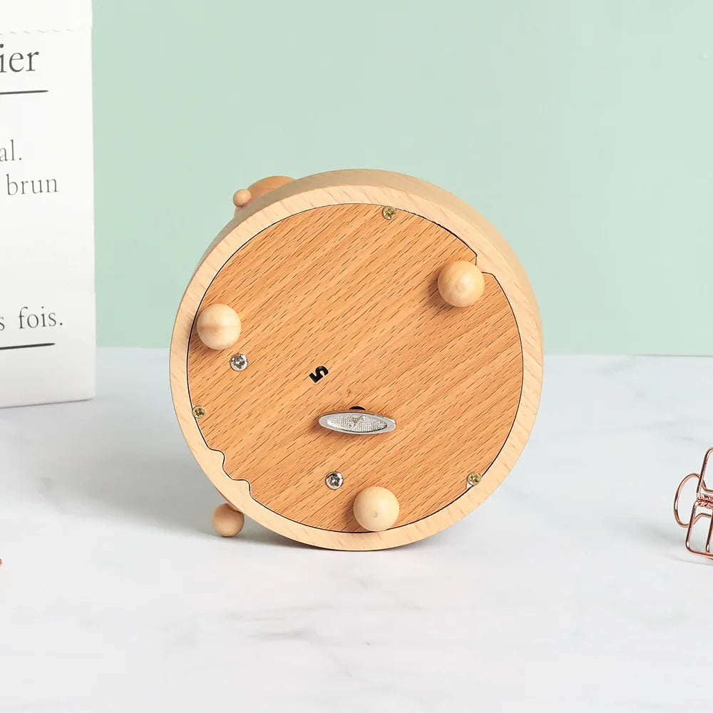 Wooden clock with round design on a light surface