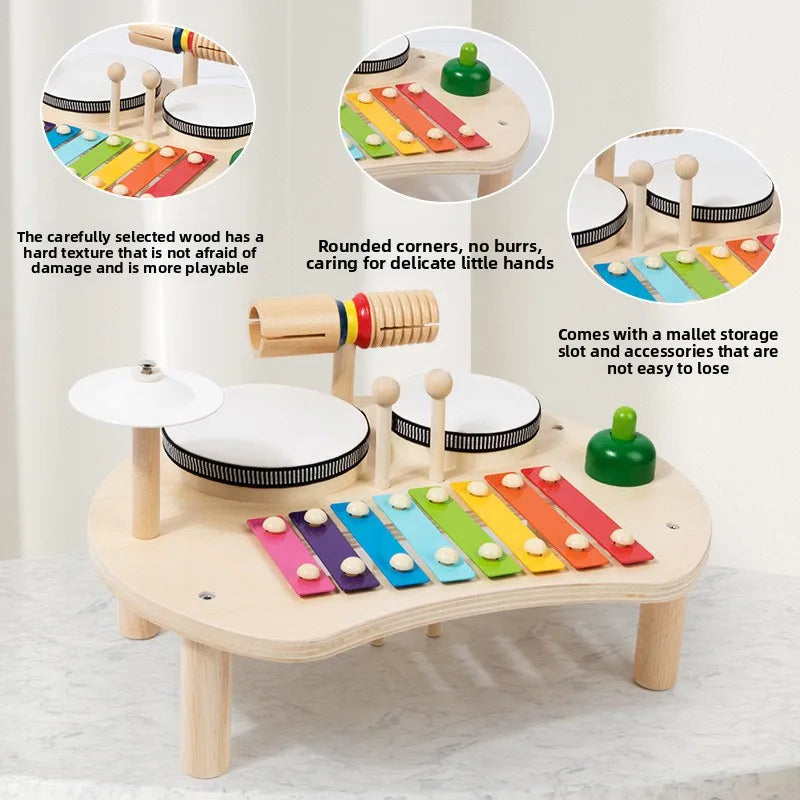 Wooden toy musical instrument set with colorful keys and mallets on a light background.
