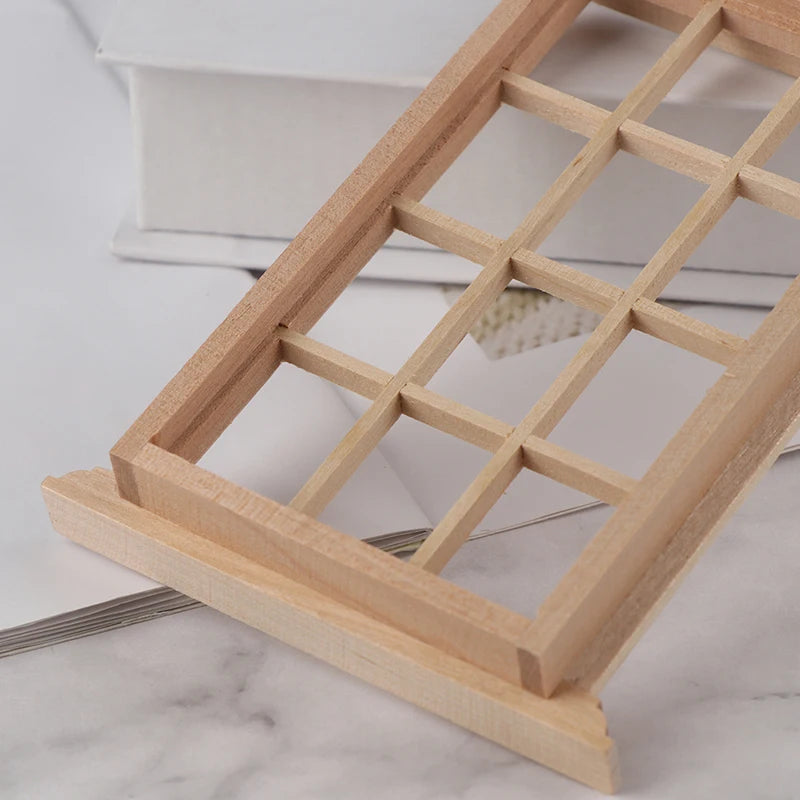 Wooden jewelry display stand on a marble surface