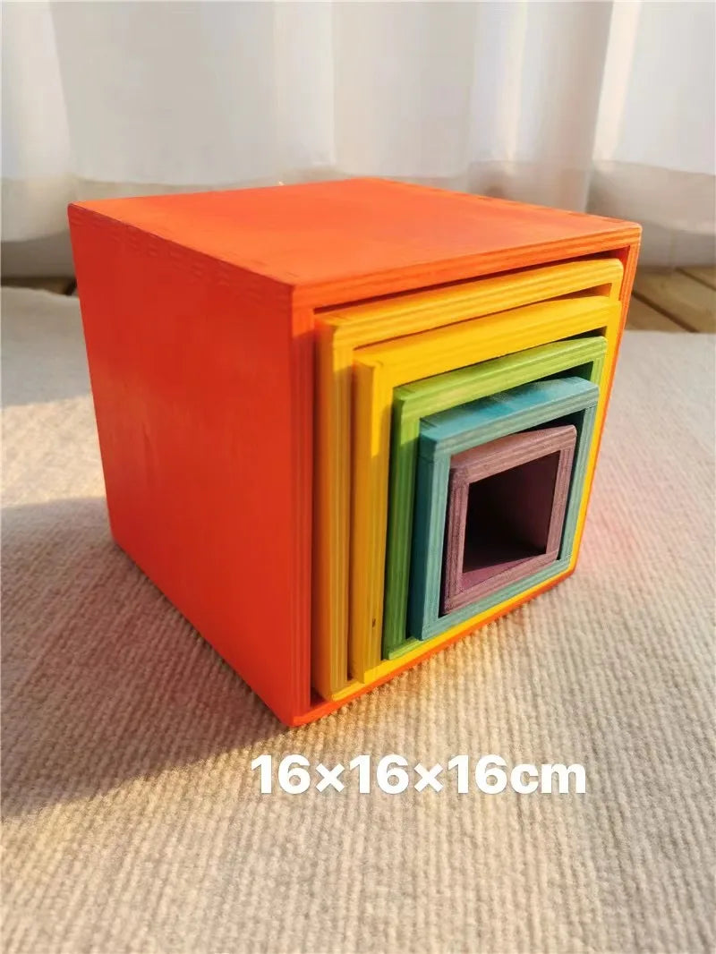Stack of colorful wooden boxes on a textured surface