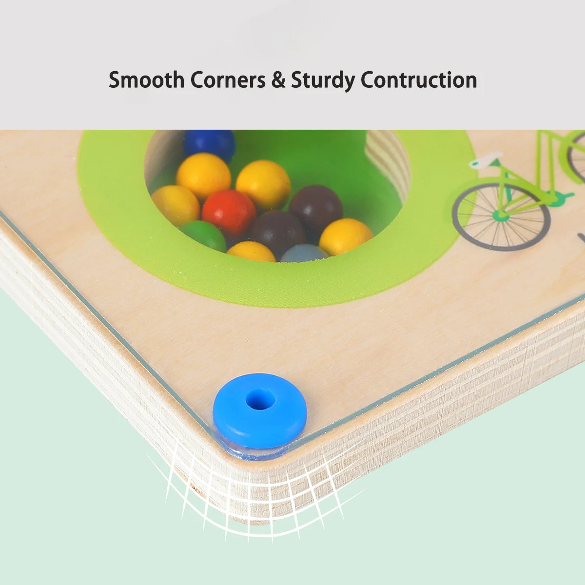 Children's play area with smooth corners and sturdy construction, featuring colorful balls and a bike toy.