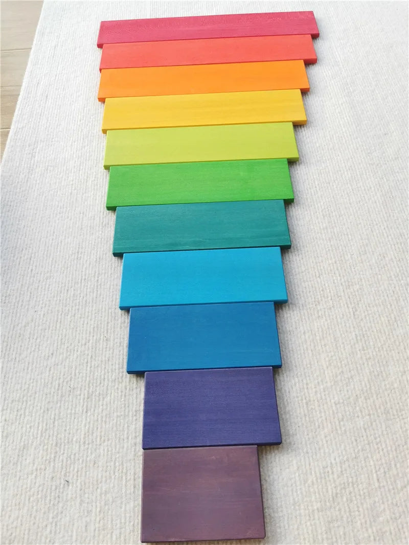 Color swatches arranged in a rainbow pattern on a textured surface