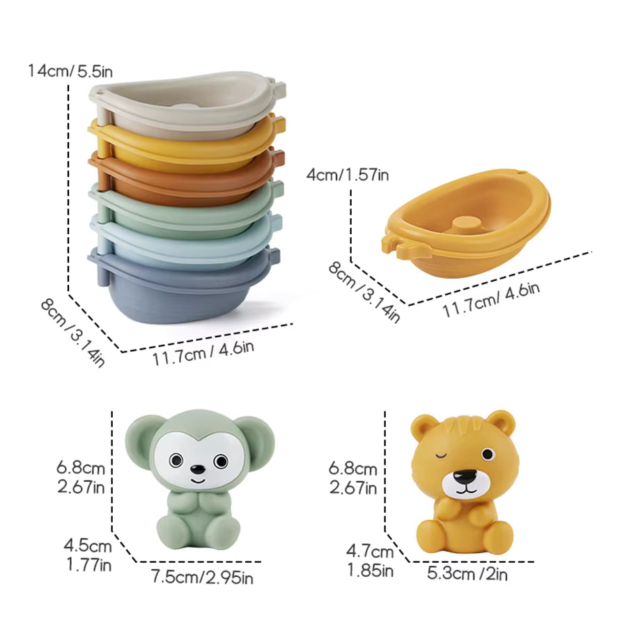 A set of colorful baby bath toys and accessories shown with dimension callouts on a white background, including stacked oval bath mats, a small boat-shaped toy, a green monkey figure, and a yellow bear figure with measurement labels.