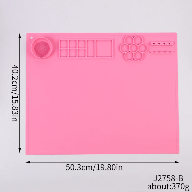 Pink silicone mat with embossed designs and measurements on a gray background