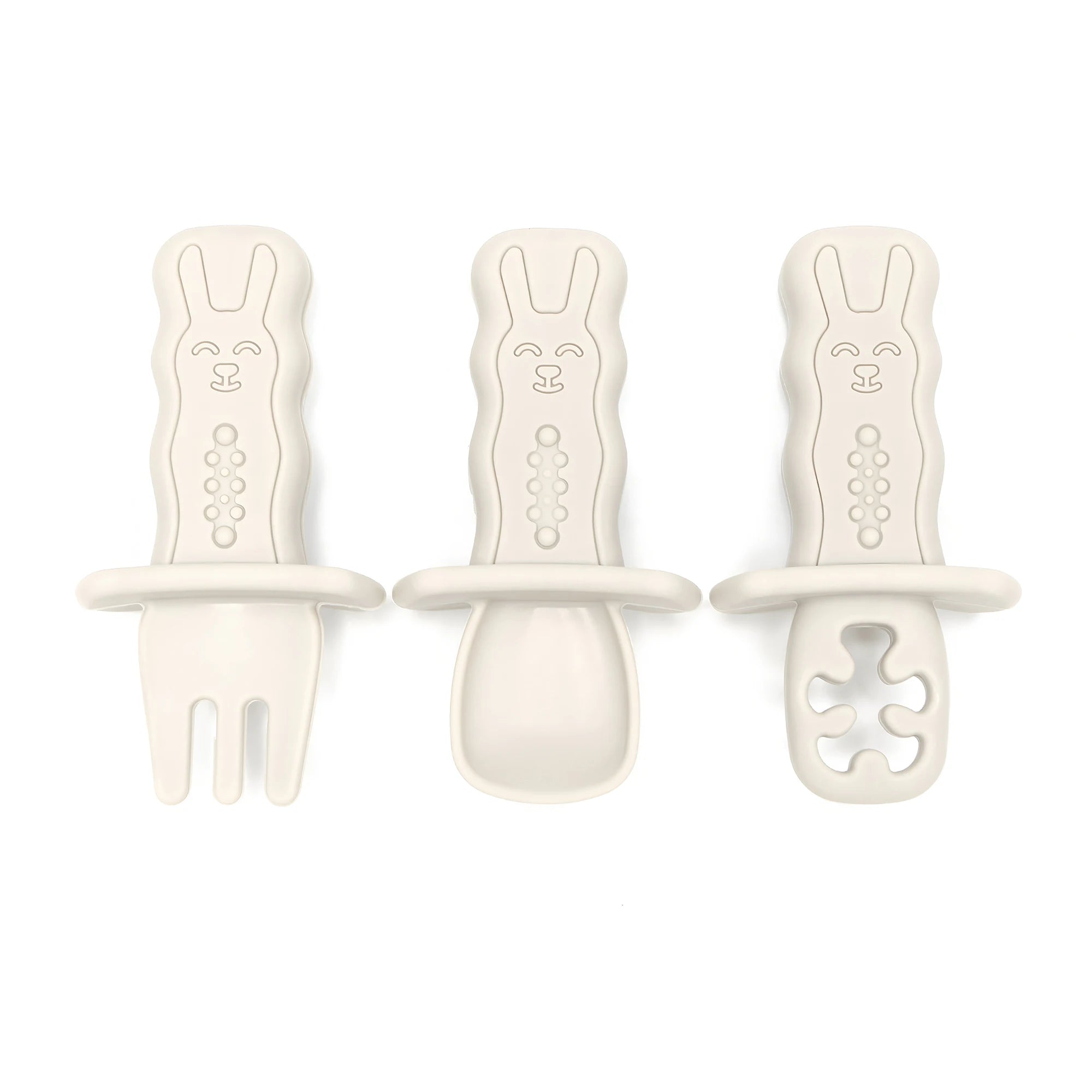 Three baby soothers with different designs on a white background