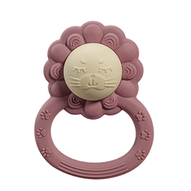Pink lion-shaped teething ring on a white background