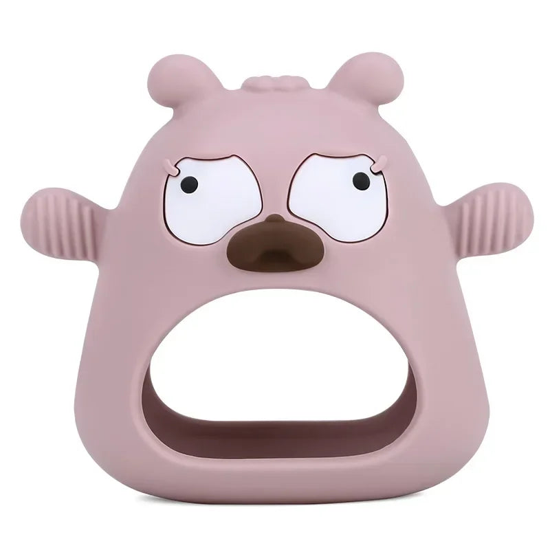 Pink cartoonish teething ring with a surprised expression on a white background