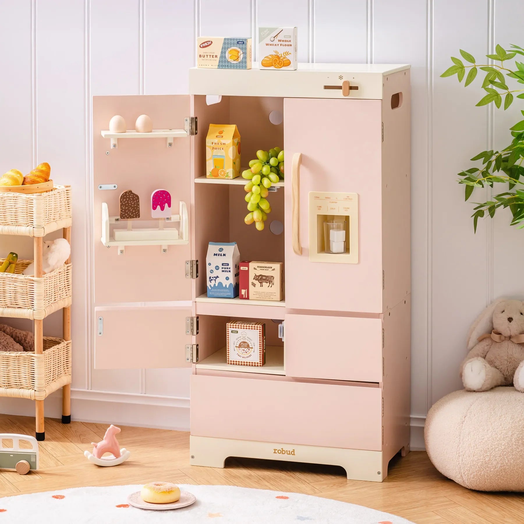 Pink children's play kitchen with shelves and cabinets in a room setting.