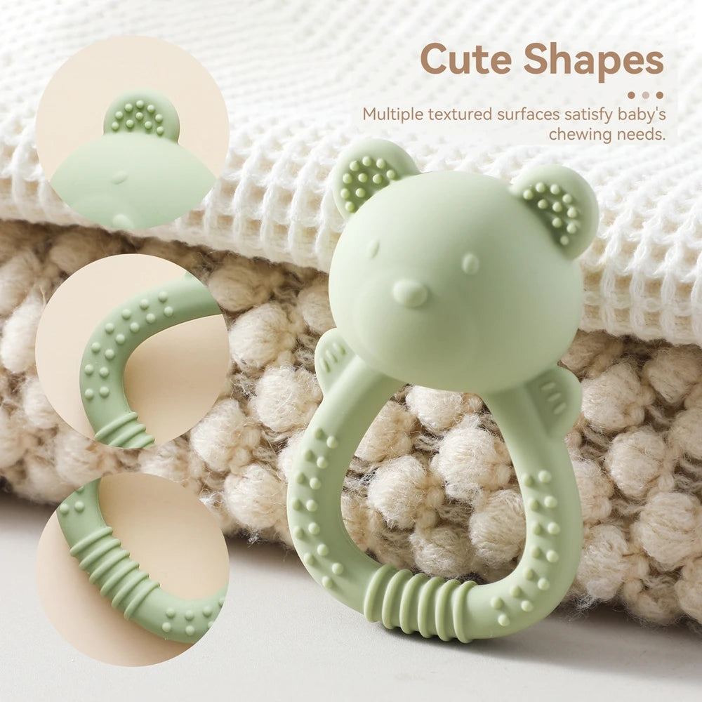 Teething ring with cute shapes on a textured surface