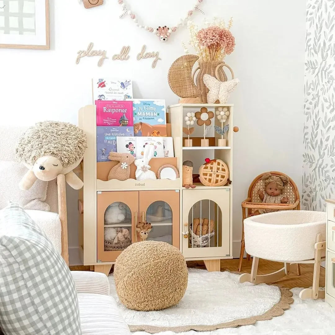 Children's room with toys, books, and furniture in a cozy setting.