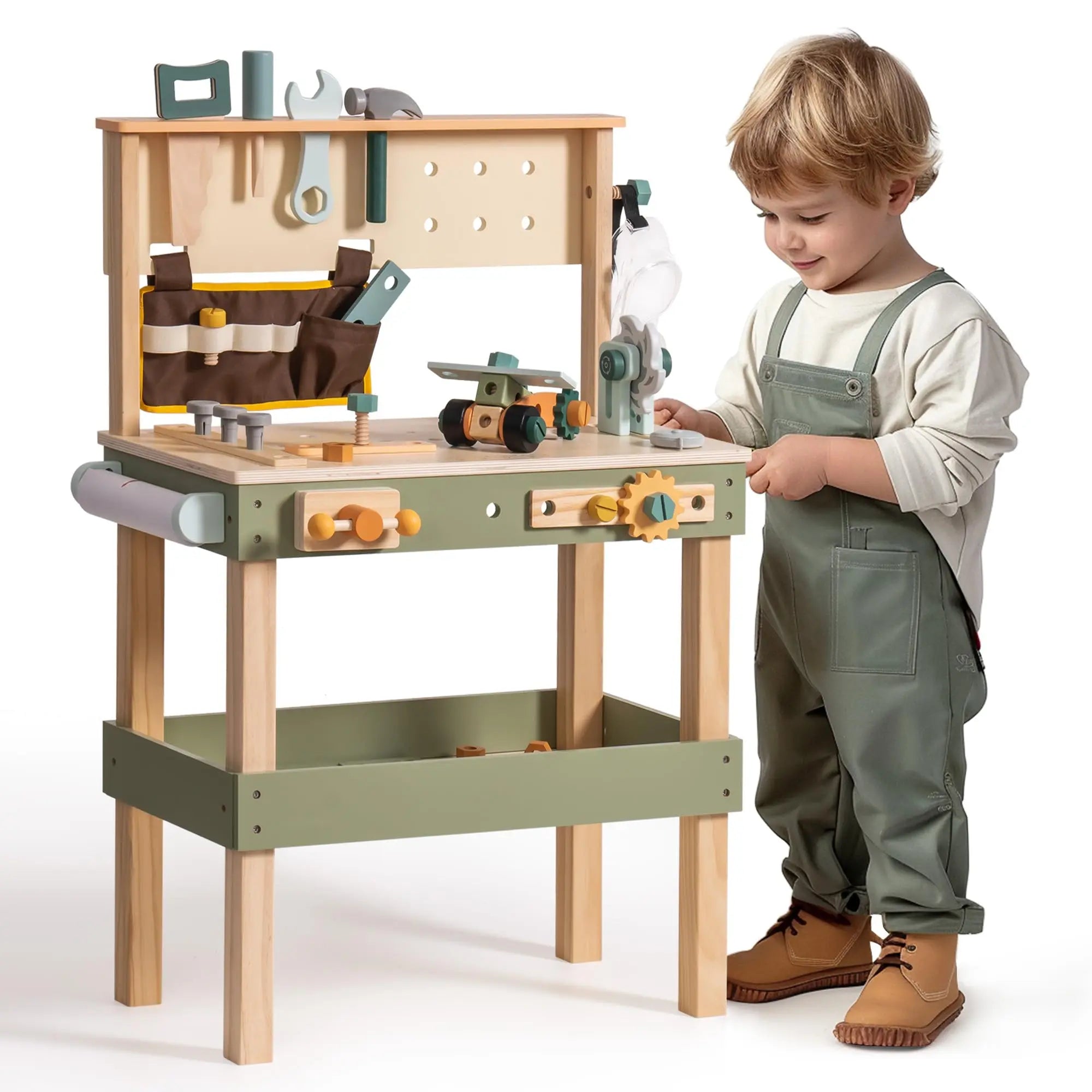 Child playing with a toy workbench set on a white background