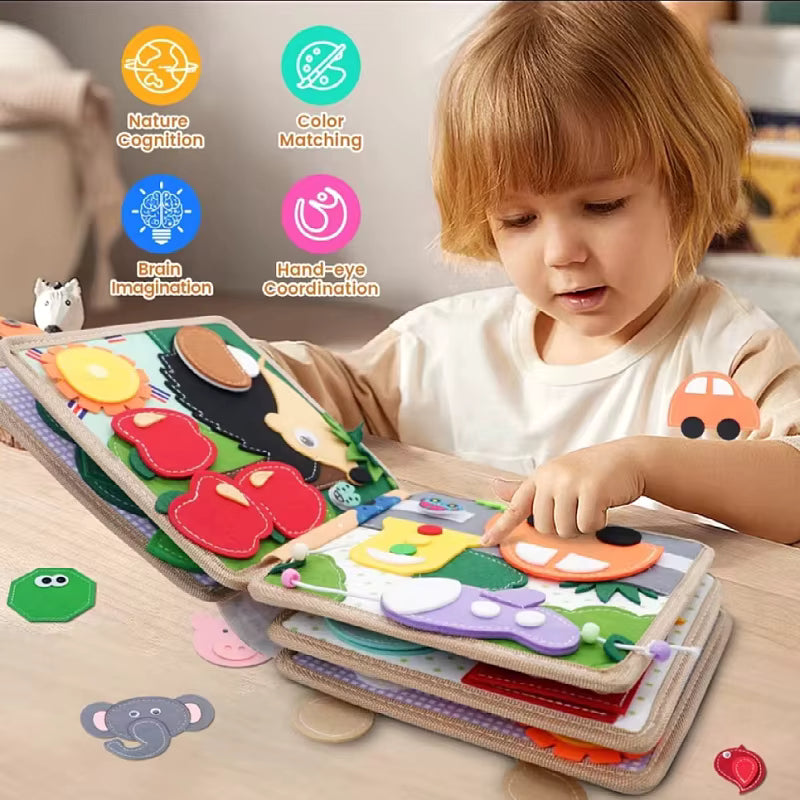 Child playing with a colorful educational toy book on a wooden surface.