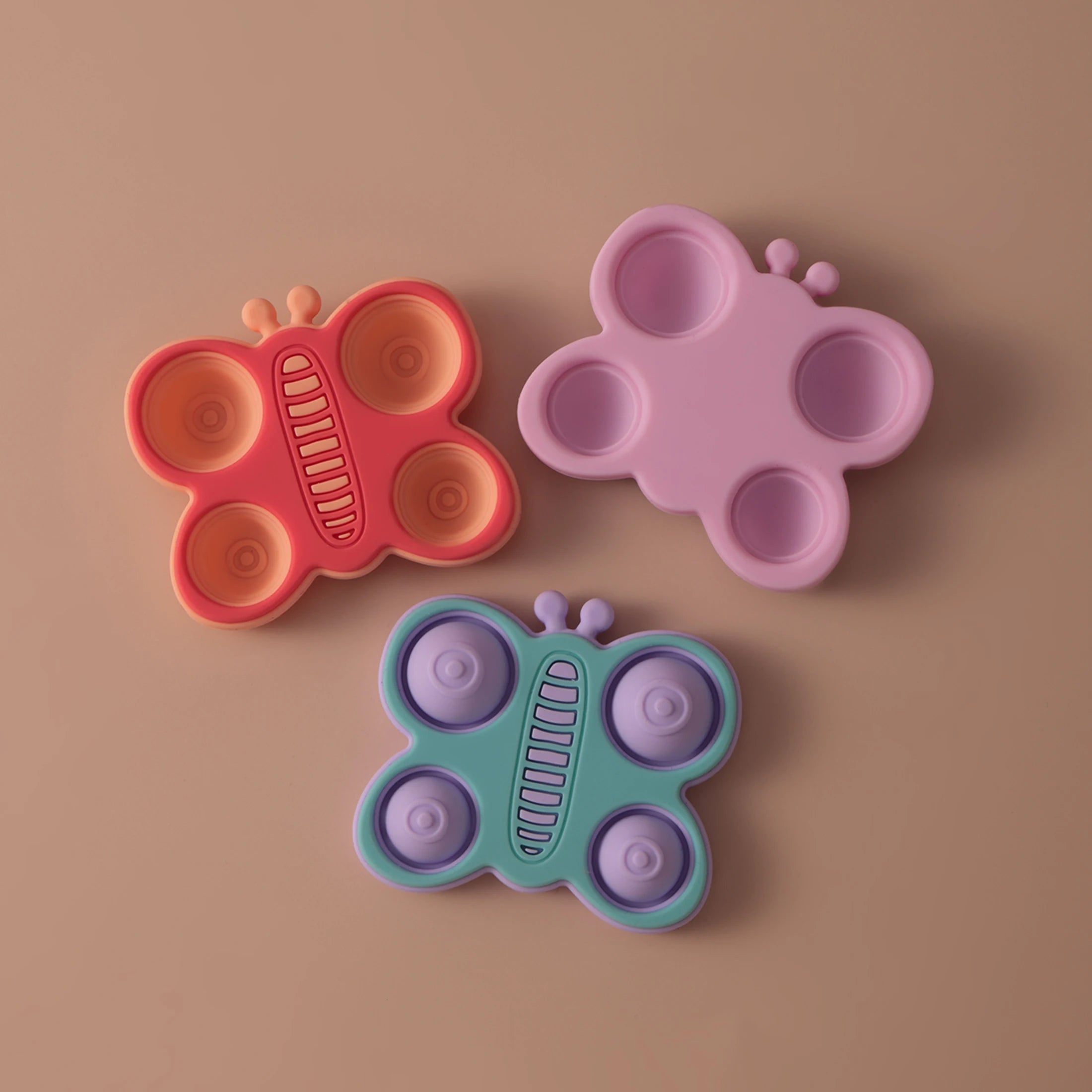 Coral, pink and mint butterfly pop silicone teethers