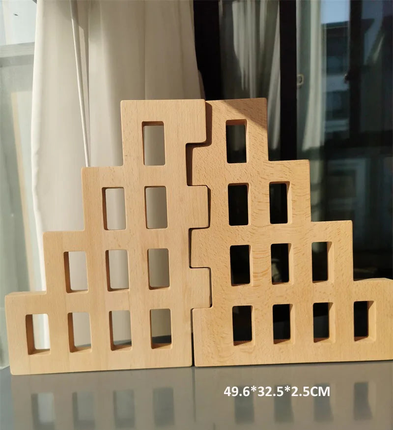 Wooden building blocks with geometric design on a reflective surface.