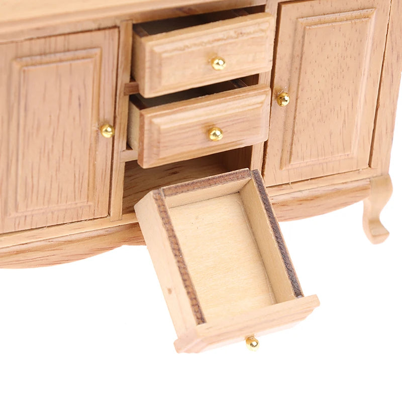 Wooden cabinet with open drawers on a white background. Oliver & Company Montessori Toys
