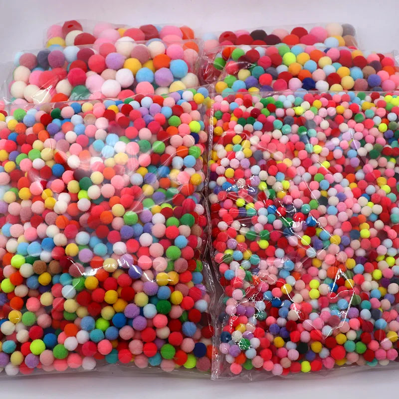 8-30mm Mixed High Elasticity Soft Pompoms packaged in plastic bags, ideal for children's DIY projects and crafting activities.