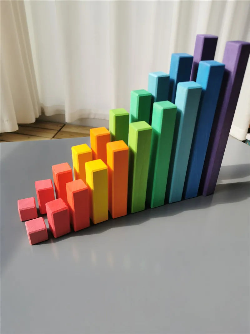 Colorful foam blocks arranged in a geometric pattern on a flat surface.