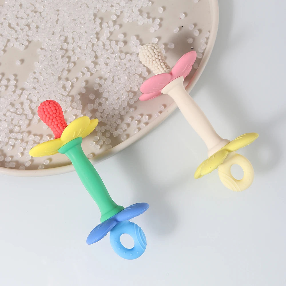 Colorful baby teether on a textured surface