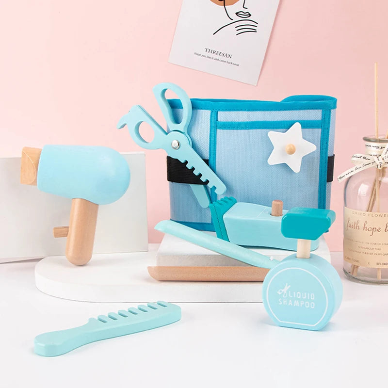 Set of children's hair care toys including a comb, brush, and hair dryer on a white surface with a pink background.