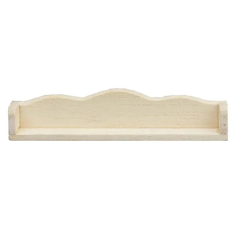 Wooden shelf with a scalloped edge on a white background