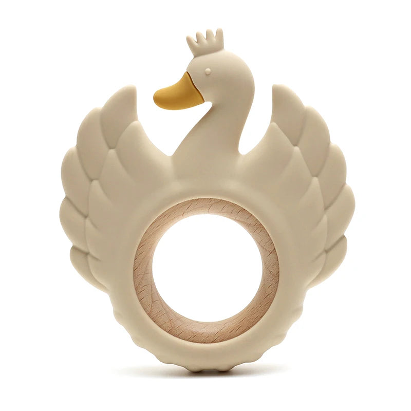Swan-shaped teething ring with a wooden ring on a white background