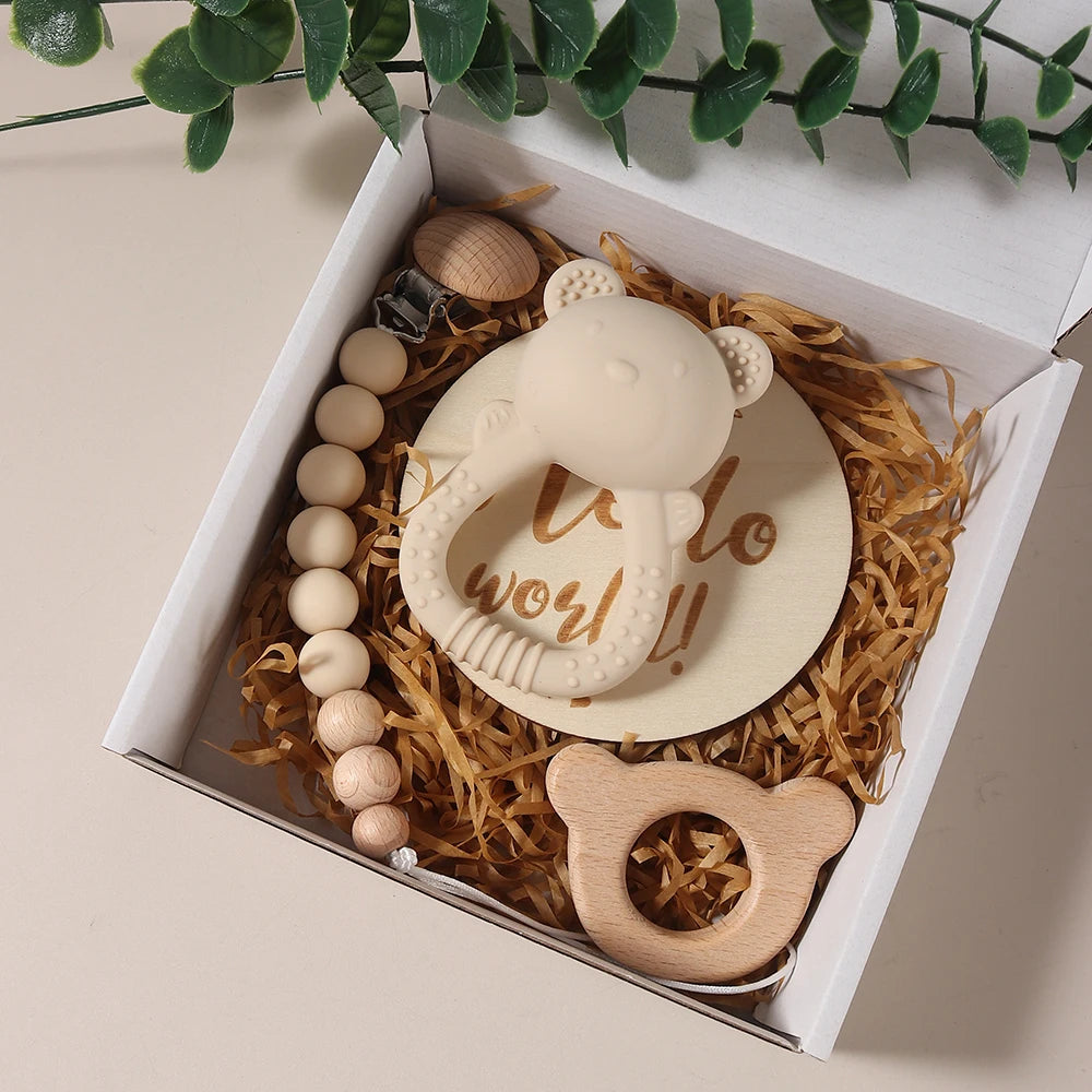 Baby teether set with 'it's a boy!' message in a decorative box.