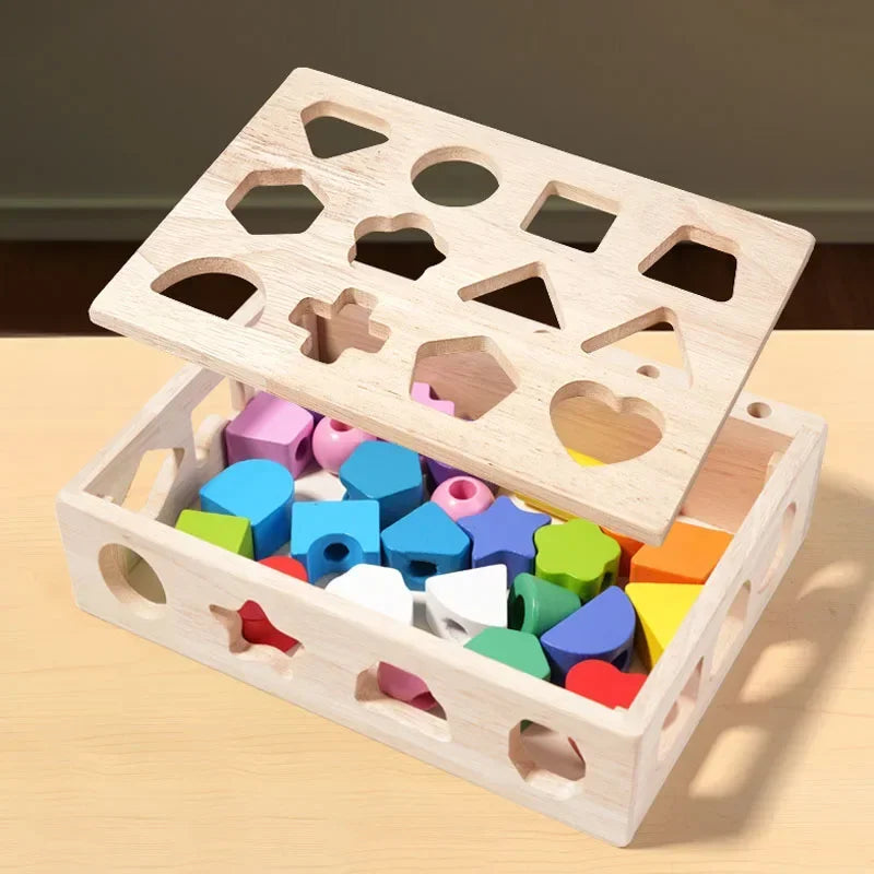 Wooden shape sorting toy with colorful blocks on a wooden surface