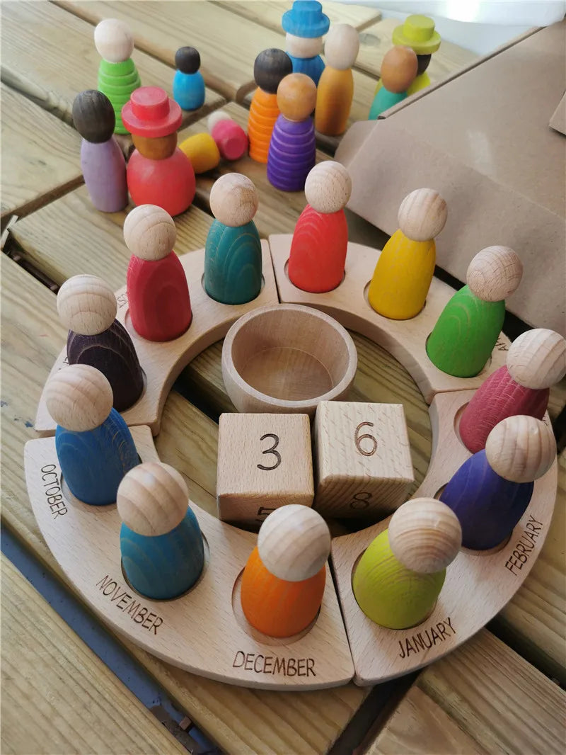 Wooden calendar with colorful peg people on a wooden surface