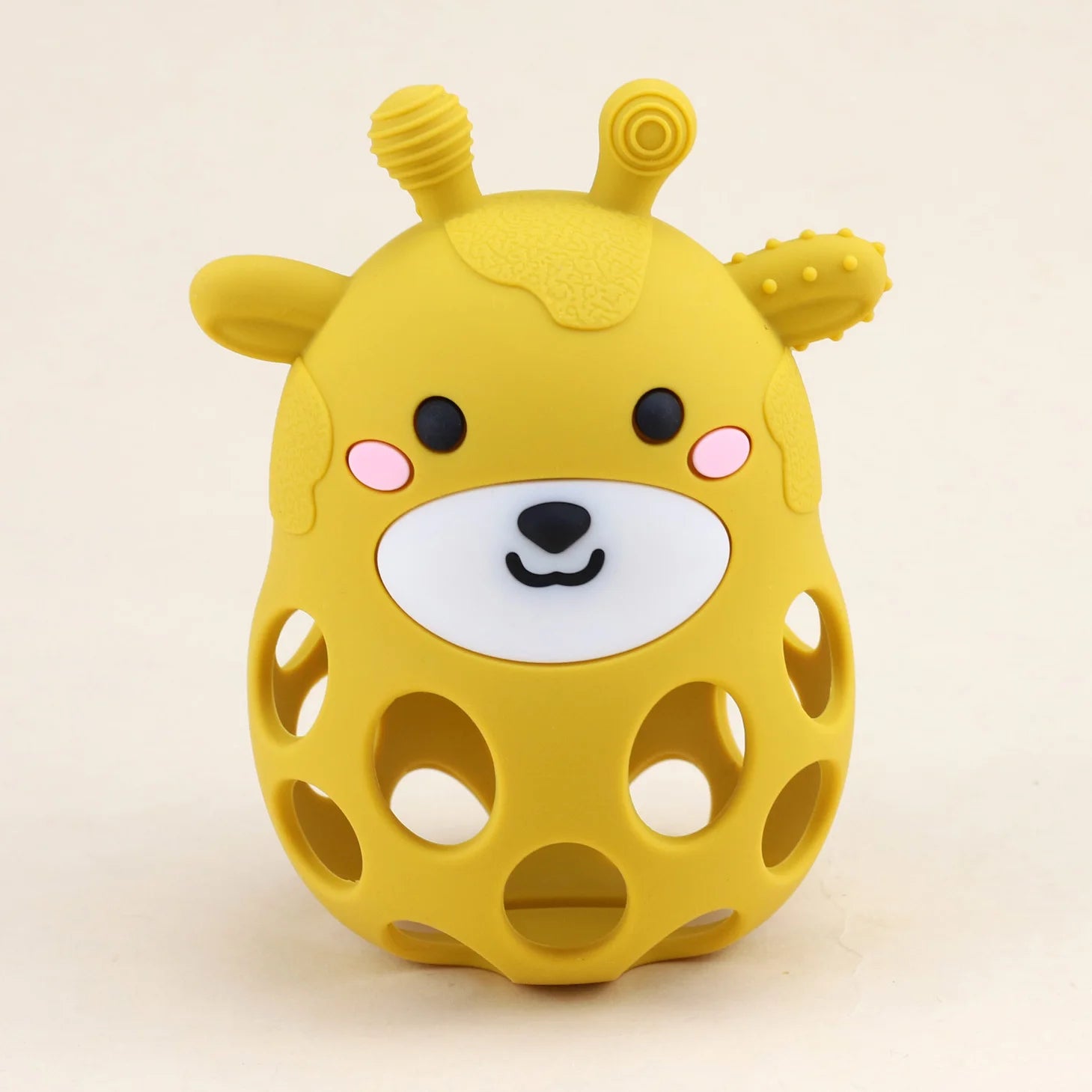 Yellow giraffe-shaped toy with a smiling face on a beige background