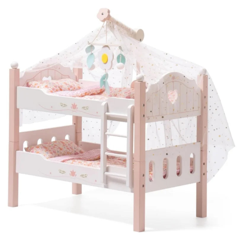 Pink and white dollhouse with canopy and bedding on a white background