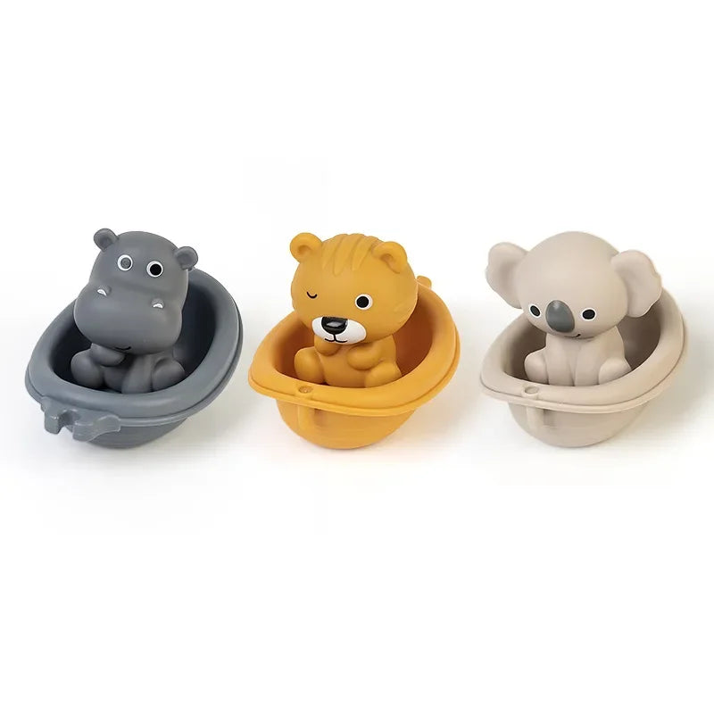 Three animal toys in their respective holders on a white background