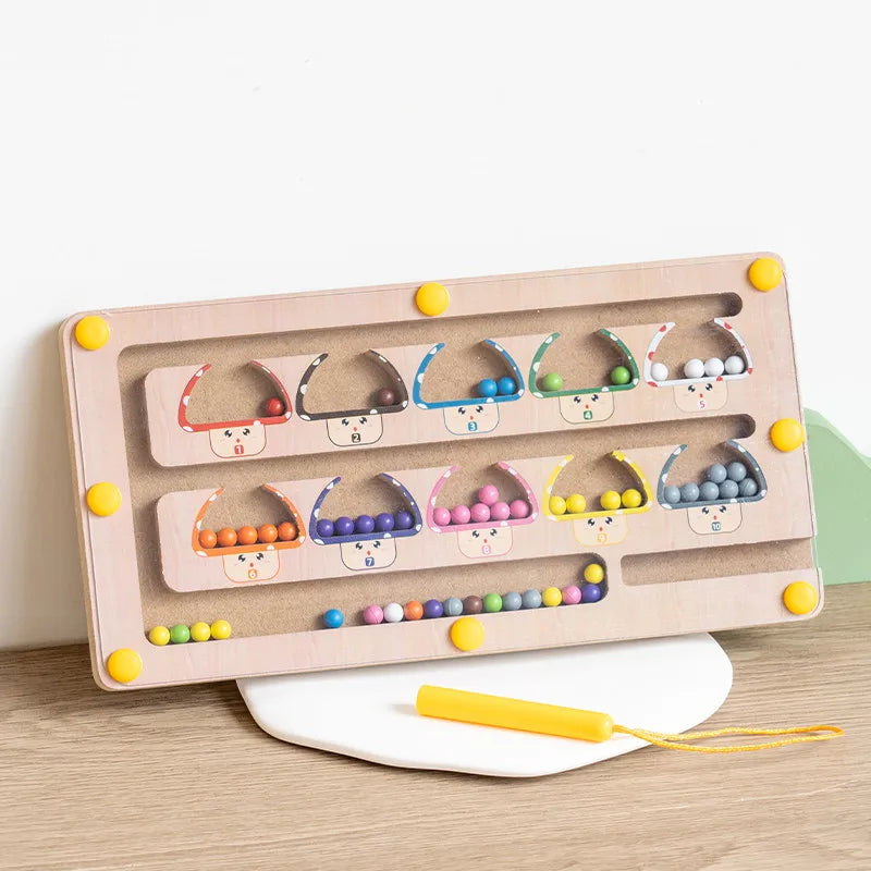 Wooden educational toy with colorful beads on a light wooden surface