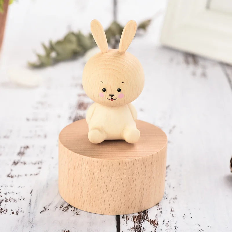 Small rabbit figurine on a wooden base with a white background | Oliver & Company Montessori toys
