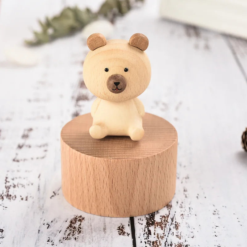 Small bear figurine on a wooden stand with a light background | Oliver & Company Montessori toys