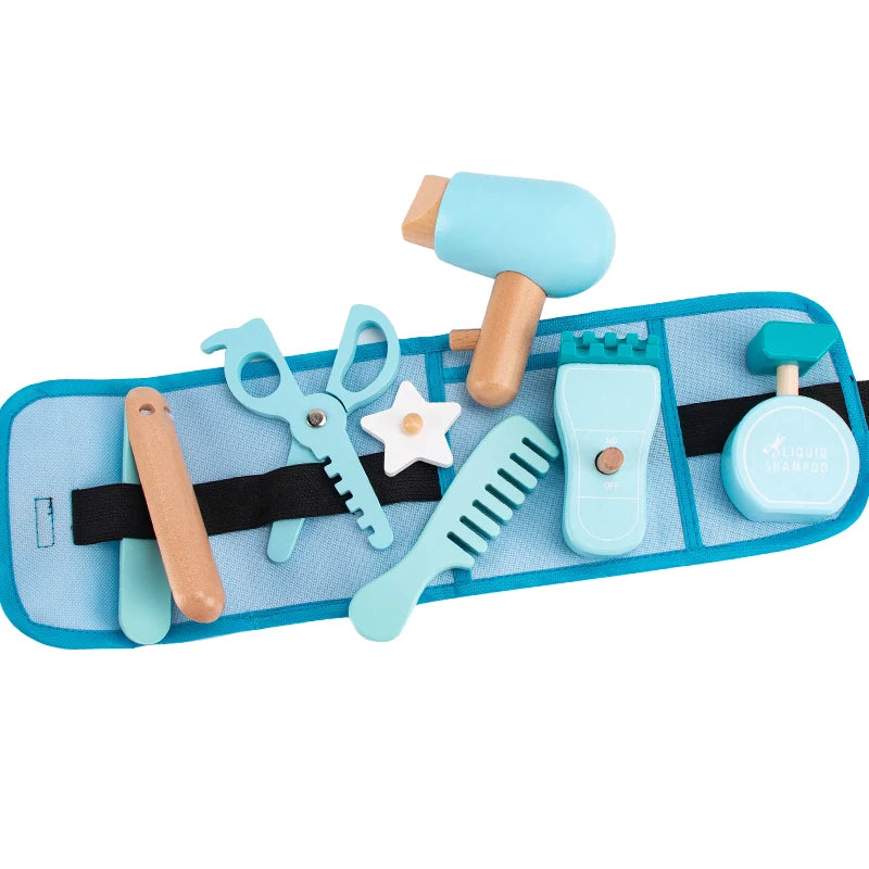 Set of toy grooming tools including scissors, comb, and other items on a blue tray with a white background.