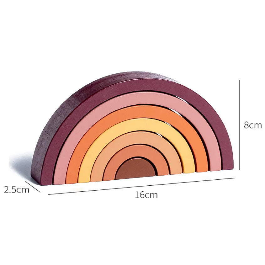 Wooden rainbow toy with measurements on a white background